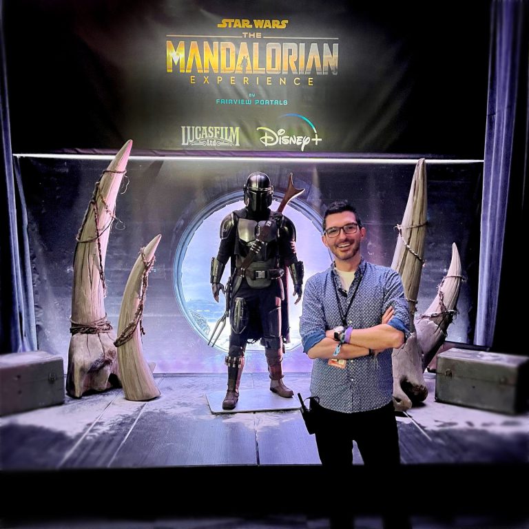 David Bawiec from EmotionCrafters standing in front of Mando. Music and Sound Design for "The Mandalorian Experience" at Star Wars Celebration created by EmotionCrafters.